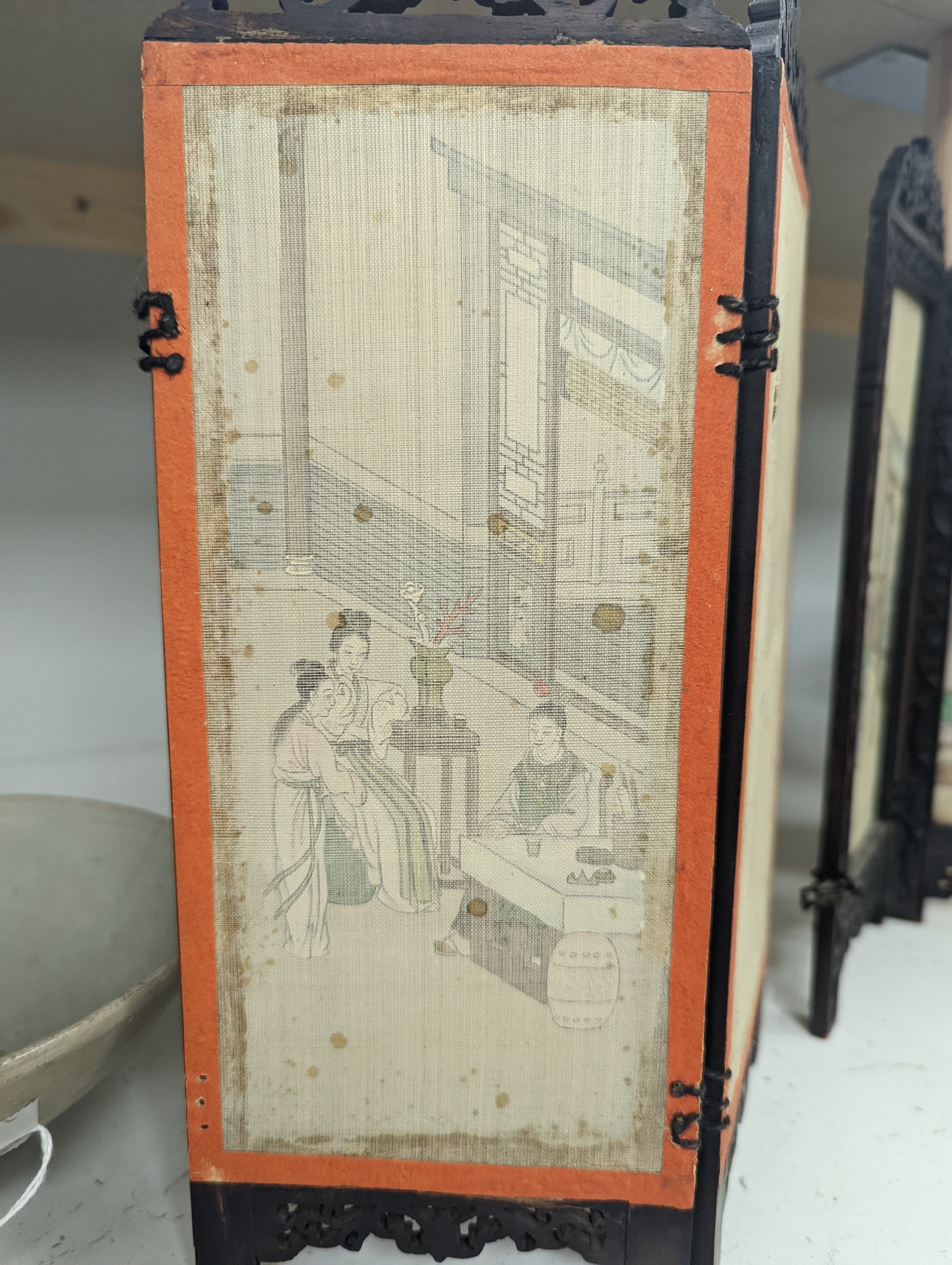 A Chinese hardwood framed painted silk four fold miniature screen, inset with painted silk panels, 28cm
